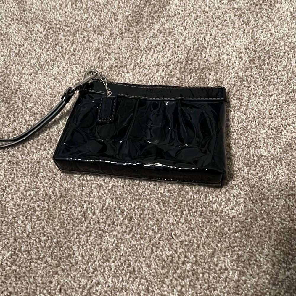 Coach black vinyl wristlet. Embossed with logo